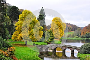 Lake and Bridge in Autumn, Stourhead Gardens, Stourton, Warminster, Wiltshire, England, UK