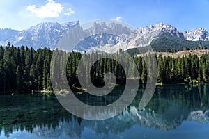 Lake Caress Dolomites Italy. Lake of Caresse in Italy. Scenic place and famous touristic destination. Primeval nature