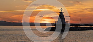 Lighthouse on Lake Champlain at sunset