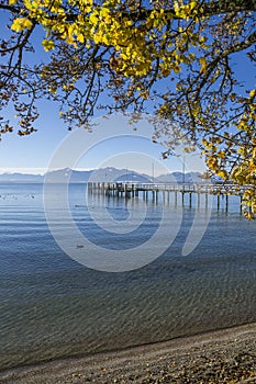 Lake Chiemsee with landing stage in autumn