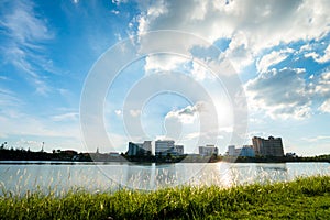 Lake in city park with skyline in background