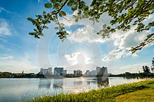 Lake in city park with skyline in background