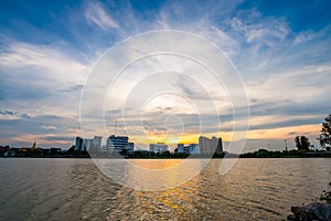 Lake in city park with skyline in background