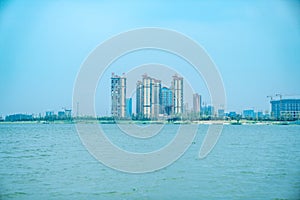 Lake and city under blue sky