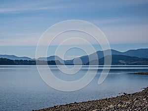 The lake with clear turquoise water is surrounded by mountains. Liptovska Mara Slovakia. The concept of ecological and active tour