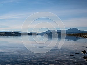 The lake with clear turquoise water is surrounded by mountains. Liptovska Mara Slovakia. The concept of ecological and active tour