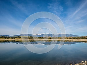 The lake with clear turquoise water is surrounded by mountains. Liptovska Mara Slovakia. The concept of ecological and active tour