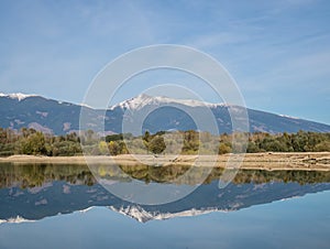 The lake with clear turquoise water is surrounded by mountains. Liptovska Mara Slovakia. The concept of ecological and active tour