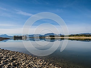 The lake with clear turquoise water is surrounded by mountains. Liptovska Mara Slovakia. The concept of ecological and active tour