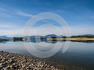 The lake with clear turquoise water is surrounded by mountains. Liptovska Mara Slovakia. The concept of ecological and active tour