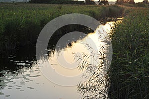 Lake with clouds reflection