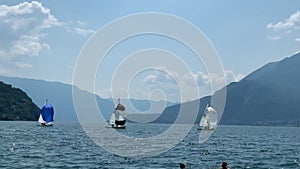 Lake Como, Bellano, Italy: Sailboats sailing on a sunny summer day