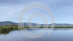 Lake in the crater of Ngorongoro National Park. Amazing landscape. The beautiful nature of Africa photo