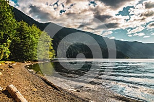 Lake Crescent beach on a sunny and cloudy day, Olympic National Park, Washington state, USA