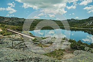 Lake from dam in a rocky terrain on highlands