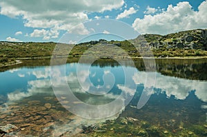 Lake from dam in a rocky terrain on highlands