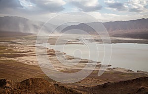 Lake in desert mountains photo