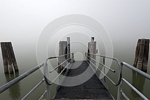 Lake dock in the fog