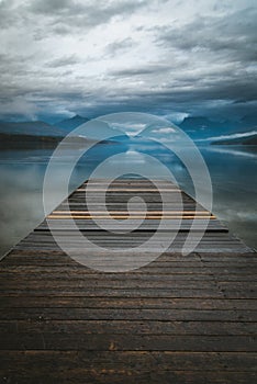 Lake dock overlooking a reflective lake.