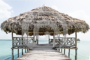 Lake dock with relaxing hammocks, El Remate, Guatemala