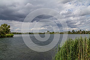 lake with dramatic sky in summer