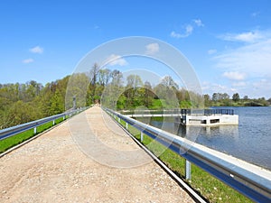 Lake Ekete , trees and dam in spring, Lithuania
