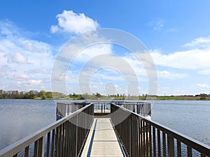 Lake Ekete , trees and dam in spring, Lithuania