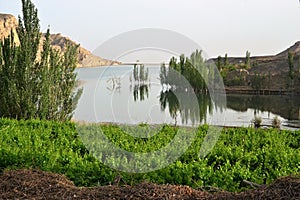 Lake at the entrance of Jiaohe Ruins landscape. 10 km west of the city of Turpan in Xinjiang Uyghur Autonomous Region