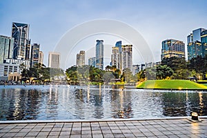 Lake in the evening, near by Twin Towers with city on background. Kuala Lumpur, Malaysia