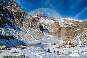 Lake Fiorenza covered with ice on the slopes of Monviso