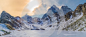 Lake Fiorenza covered with ice on the slopes of Monviso