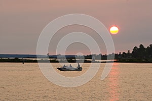 Lake fishing at sunset