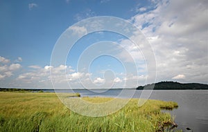 Lake, flood plain and skies