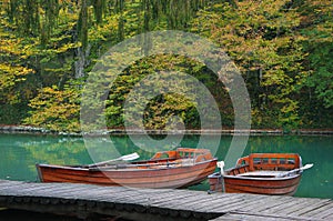 Lake in forest with boat in national park Plitvice, Croatia