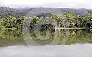 Lake with forest reflection wave and The mountain.