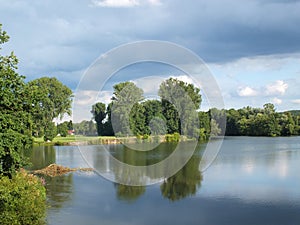 A lake framed by greenery