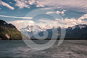 Lake Geneva and snow capped mountains in Switzerland