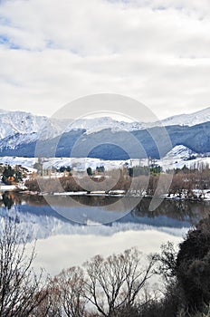 Lake Hayes with snow mountain reflections