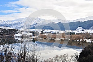 Lake Hayes with snow mountain reflections