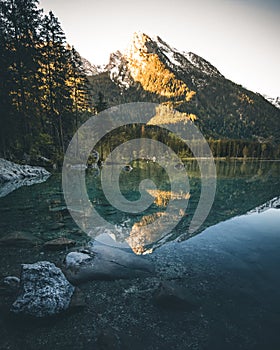 lake hintersee during spring with mountain reflection