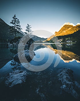 lake hintersee during spring with mountain reflection