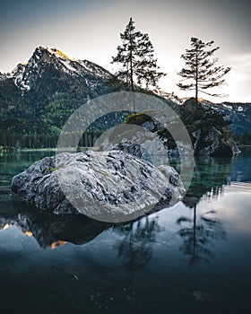 lake hintersee during spring with mountain reflection