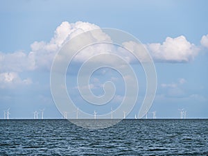 Lake IJsselmeer horizon with wind turbines of windfarm near Urk, Netherlands