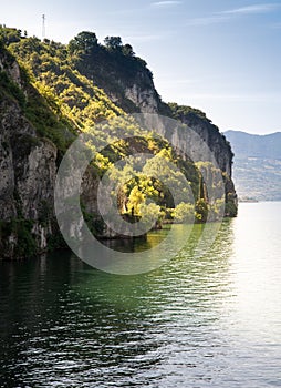 Lake Iseo cliff coast, Lombardy, Italy. Oglio bicycle route