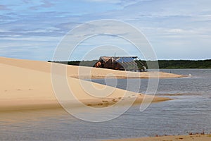Lake with islands and sand hill. In the background vegetation. Northeast region of Brazil, Atins, MaranhÃ£o