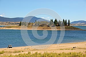 Lake Jindabyne, Australia with a car parked by the lake