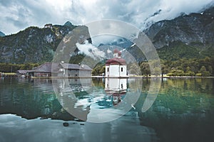 Lake Koenigssee with St. Bartholomae pilgrimage chapel in summer, Bavaria, Germany