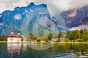 The lake KÃ¶nigssee is surrounded by mountains