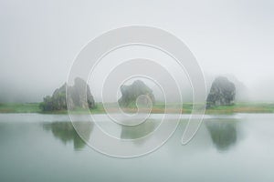 Lake in La Arboleda with rocks photo