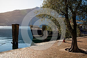 Lake - Lago di Garda. Riva del Garda resort, Trentino, Italy. Town waterfront and ferry. photo